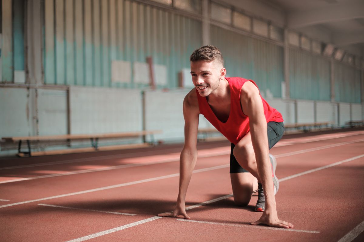 Athlete stretching before training